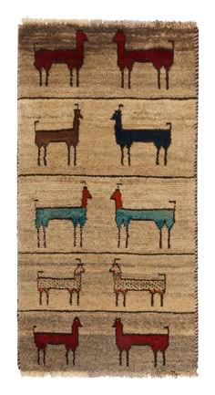 an old rug with different colored sheeps and horses on the front, in various colors