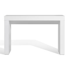 a white table that is sitting on the ground