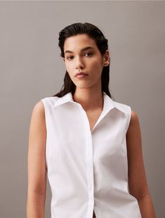 A versatile staple, crafted from poplin cotton blended with stretch for breathability and comfort. Made with a hidden placket, button-front closures and a cutout at the back.  Material: 96% Cotton, 4% Elastane. Top Calvin Klein, Cutout Top, Cut Out Top, Calvin Klein, Cotton Blend, The Back