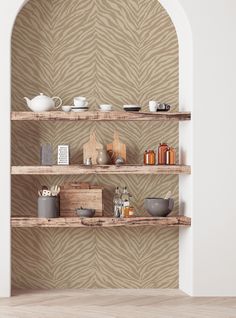 the shelves are made from wood and have different types of items on them, such as teapots