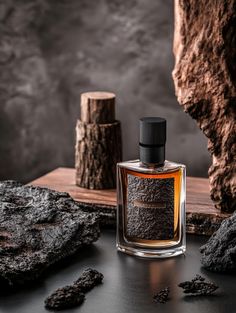 A striking perfume bottle set against a rugged, dark background with natural rock elements, evoking strength and masculinity. Perfect for men's fragrance branding and product photography inspiration. #MensFragrance #PerfumePhotography #MasculineElegance #ProductDisplayIdeas Perfume Bottle Photography, Perfume Bottle Display, Fragrance Branding, Male Perfume, Countdown Quotes, Dior Fahrenheit, Perfume Product, Product Photo Ideas, Fragrance Photography