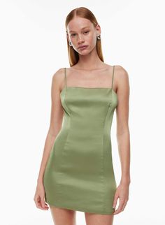 The Ten Shimmer Satin Dress is a satin mini dress. Our quintessential '90s mini, this is a lined slim-fit dress with a straight neckline and adjustable straps. It’s cut from lightweight stretch satin with a subtle sheen. Floral Satin Dress, Dress Emerald Green, Aritzia Dress, Dark Green Dress, Shimmer Dress, Chiffon Long Sleeve, Slim Fit Dresses, Satin Mini Dress, Straight Neckline