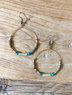 Bohemian blend of earthy agate, heishi and turquoise for a timeless, year-round stunner! -2” hoop Bohemian Metal Hoop Earrings With Colorful Beads, Handmade Turquoise Hoop Earrings With Round Beads, Unique Handmade Turquoise Hoop Earrings, Bohemian Turquoise Hoop Earrings With Natural Stones, Turquoise Dangle Hoop Earrings With Colorful Beads, Natural Turquoise, Vintage Designs, Austin, Agate