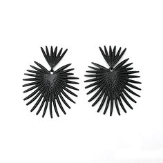 Make a bold statement with these ARI Statement Earrings! Featuring an eye-catching design, these earrings will add pizzazz to any outfit. Whether you're headed for a night out on the town or a casual walk in the park, these earrings are the perfect accessory for any occasion! Black Party Earrings For Summer, Chic Black Earrings For Summer, Summer Party Pierced Earrings, Black Hoop Earrings For Summer Gift, Bold Black Drop Earrings, Bold Party Earrings For Pierced Ears, Black Dangle Earrings For Summer, Trendy Black Clip-on Earrings, Modern Black Jewelry For Summer