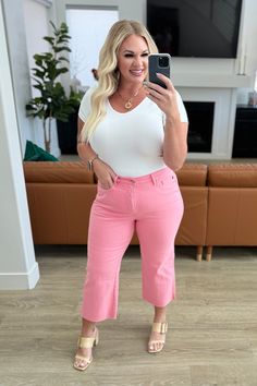 Slip into style and comfort with our Lisa High Rise Control Top Crop Jeans from Judy Blue. Featuring tummy control technology and 4-way stretch, these jeans provide a flattering fit. The wide leg crop and raw hem add trendy details, while the fun pink color will brighten up any outfit. Garment dyed for lasting color. Judy Blue High Rise Zip Fly Control Top Wide Leg Crop Silhouette Raw Hem 93% Cotton, 6% Polyester, 1% Spandex True to Judy Blue Sizing 0/24: Waist: 24" Hips: 32" Rise: 10.5" Inseam: Fly Control, Judy Blue Jeans, Top Crop, Crop Jeans, Dress Romper, Hat Hairstyles, Cropped Jeans, Long Tops, Dress Accessories