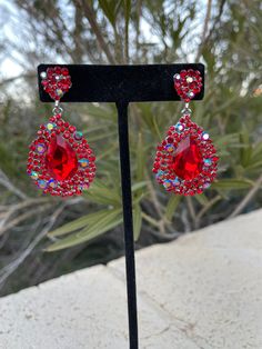 Red Rhinestone Party Jewelry, Red Rhinestone Crystal Earrings For Party, Red Crystal Rhinestone Earrings For Party, Red Rhinestone Jewelry For Evening, Red Rhinestone Evening Jewelry, Evening Red Jewelry With Rhinestones, Red Drop Earrings For Party, Red Crystal Earrings With Rhinestones For Evening, Red Crystal Dangle Earrings For Party