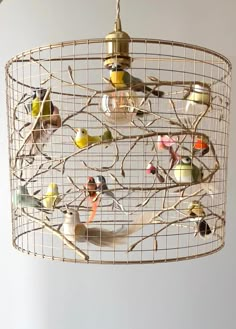 a chandelier that has birds on it