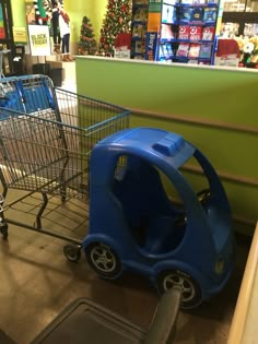 two shopping carts sitting next to each other in a store