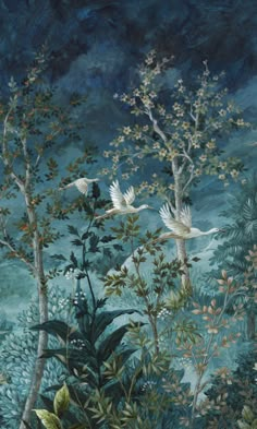 two white birds flying over trees and plants