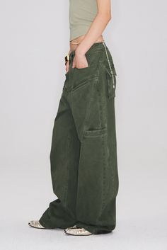 Reinvented Utility with a Sleek Touch Elevate your casual wardrobe with these Structured Baggy Green Cargo Pants. These pants blend utility and style with their multiple pockets and strategic cuts that enhance the silhouette without overwhelming. The light wash adds a touch of vintage appeal, ensuring comfort and style go hand-in-hand. Style #: WWAJ016 Cargo Pant Photoshoot, Baggy Linen Cargo Pants, Green And Beige Outfit, Baggy Green Cargo Pants, Womens Cargo, Hand Style, Tank Top Skirt, Resort Wear Dresses, Casual Activewear