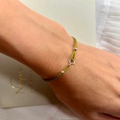 Experience enduring sophistication with our String Bracelet for Women—a delicate masterpiece embellished with 14k gold clips and solid 18k gold beads. This minimalist wish bracelet embodies understated luxury, perfect for solo wear, providing a delicate touch, or stacked to make a bold statement of friendship and style. Made from Solid 18k Gold Bead and 14k Gold Clips Waterproof jewelry Adjustable size 9 color options Gift packaging Quality certificate FREE shipping worldwide Bead size 3mm This Elegant Bracelets With Tiny Beads For Friendship, Adjustable Minimalist White Gold Beaded Bracelets, Minimalist Adjustable White Gold Beaded Bracelets, Adjustable White Gold Beaded Bracelets, Dainty White Gold Adjustable Beaded Bracelets, Dainty White Gold Beaded Bracelets Adjustable, Adjustable White Gold Beaded Bracelet, Gold Bracelets With Sterling Silver Clasp For Everyday, Gold Bracelet With Sterling Silver Clasp For Everyday