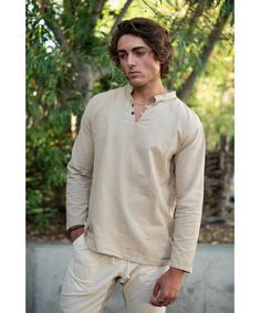 "｡✧ Shop our graceful store at cottonflowerclothing.com ✧｡ Fly enough to create interest, classic enough to be trustworthy. Our cotton is substantially thick as not to be transparent, yet light and breathable. Like all our clothing, this long sleeve shirt is 100% natural cotton, vibrating at the Earth's frequency of love.   Our Men's Collection is designed to provide total comfort, simplicity, and sophistication worldwide. Ideal for international adventures as you will always be perfectly styled. Measurements:  Medium Chest 42\" inches around Sleeves 30\" inches long from base of neck Length 29\" inches overall Waist & Hips 42\" inches around Large Chest 44\" inches around Sleeves 30.5\" inches long from base of neck Length 29.5\" inches overall Waist & Hips 44\" inches around XLarge Chest Neutral Long Sleeve Cotton Top, Gauze Clothing, Gold Clothing, Happy Clothes, Man Weave, Dressing Style, Cotton Long Sleeve Shirt, Men's Collection, Winter Wear