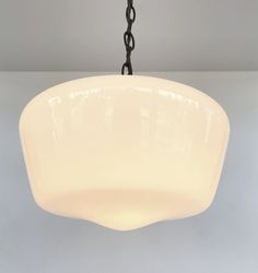 This large Milk Glass Pendant Light Fixture is just the right size for today's homes. And with the traditional edge of an Antique style Schoolhouse Opal Glass Globe, it will be a timeless beauty for many years. Gorgeous! Product Details 9" high and 12" wide large schoolhouse milk glass globe 3' Matching Chain & Cotton Covered Wire (adjustable) (1) 60W equivalent LED or CFL Bulbs or (1) 60W Incandescent (not included) Antique Black finish (available) Rubbed Bronze (shown) 5″ Canopy & Hardwired In Milk Glass Light Fixture, Milk Glass Pendant, Milk Glass Pendant Light, Galvanized Light, Glass Light Fixture, Farmhouse Light Fixtures, Chandelier Lighting Fixtures, Kitchen Ceiling, Hanging Chandelier