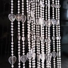 a group of heart shaped beads hanging from the ceiling