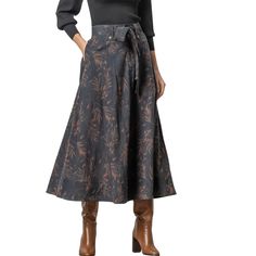 With a plain front and elastic at the back waist, this skirt is super flattering. Fall Workwear Lined Maxi Skirt, Relaxed High Waist Skirt With Elastic Waistband, High Waist Skirt With Elastic Waistband And Relaxed Fit, High Waist Skirt With Elastic Band, Relaxed Skirt With Pockets For Fall, High Waist Lined Skirt For Fall, High Waist Flowy Lined Skirt, Full Skirt For Workwear In Fall, Fall Wide Leg Lined Skirt Bottoms