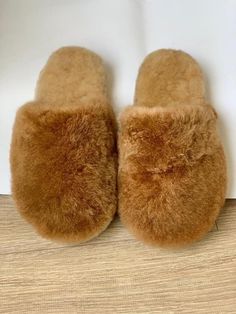 Alpaca fur slippers - alpaca slippers from Peru - unisex slippers - fur slippers - winter slippers - Gift for any occasion - fluffy fur slippers The unisex Luxurious Alpaca fur slippers keep your feet nice and cozy even on the most blustery winter's eve. These fur slippers are very well made, ensuring they will last for years. The best part is that these slippers are made from ethically-sourced alpaca fur, ensuring the highest quality and guilt-free comfort. With each step, you'll feel like you' Comfy Faux Fur Slippers With Round Toe, Soft Texture Indoor Slippers With Round Toe, Cozy Slip-on Slippers With Soft Texture, Cozy Faux Fur Slippers With Round Toe, Cozy Soft Texture Slip-on Slippers, Cozy Slippers With Soft Texture And Round Toe, Fluffy Slip-on Cozy Slippers, Cozy Fluffy Slip-on Slippers, Comfortable Fluffy Sheepskin Slippers