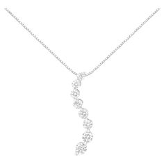 Surprise her by gifting her this beautiful 3.00 cttw diamond journey pendant on any special occasion. Featuring a classy design, the pendant is crafted of cool 14kt white gold. It is elegantly adorned with sparkling 8 graduating, prong-set round cut diamonds. The pendant is flanked with 54 sparkling baguette diamonds on the side for an extra sparkle. There is no better way to symbolize your growing love as you journey together. This piece comes with an AGS certificate for added peace of mind. Pr Dramatic Necklace, Journey Pendant, Baguette Diamonds, Bagan, Baguette Cut Diamond, Baguette Diamond, Round Brilliant Cut Diamond, Round Cut Diamond, Brilliant Cut Diamond