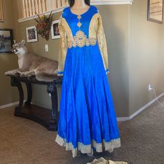 Not : Can Also Be Used As Single Piece Down Dress .It's 3 Pieces ( Anarkali , Salwar & Dupatta ) Dress Length 56" Inc Long Beautiful Work Done On The Front Thread And Stones . Fabric : Top Khadi Cotton And Inner Is Santoon And Also Net Net Inner To. Brest Size 36"Inc But It Can Be 40" There 2inc Fabric On Each Side. The Sleeves Are Attached To Top And There 24" Long Lace Work Done On It . Pants Are 47inc Long And It's Santoon Skin Color . Dupatta Fabric : Soft Net Border On Two Ends. Blue Anarkali Set For Eid, Blue Bollywood Anarkali Set For Designer Wear, Blue Anarkali Churidar With Cutdana, Anarkali Blue Churidar With Cutdana, Traditional Blue Maxi Anarkali Set, Traditional Blue Anarkali Set Maxi Length, Blue Zari Work Anarkali Set Maxi Length, Floor-length Blue Kurta For Navratri, Blue Dabka Anarkali Set For Diwali