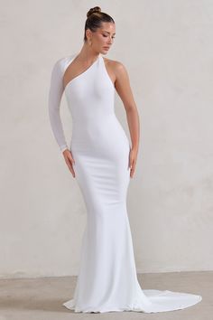 Channel Hollywood glamour as we enter wedding season in this floor-sweeping white showstopper. Crafted from flattering stretch jersey fabric. our Katarina maxi dress flaunts a wrapped cut-out neckline with a single long sleeve and an exposed shoulder. Katarina's long skirt trails from behind in theatric fashion. making you and your silhouette truly unforgettable.Features- Premium stretch jersey- Wrapped cut-out neckline- Single long sleeve- Bodycon fit- Fishtail skirt with train- Maxi length Siz White Evening Dress With Asymmetrical Neckline For Prom, White Asymmetrical Evening Dress For Gala, Elastane Maxi Dress For Prom, White Evening Dress With Fitted Bodice And Asymmetrical Neckline, White One Shoulder Evening Maxi Dress, White One-shoulder Evening Maxi Dress, White Gown With Asymmetrical Neckline For Party, White Gown With Asymmetrical Neckline For Evening, White Evening Dress With Asymmetrical Neckline