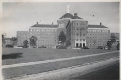 an old black and white photo of a large building