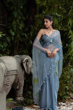 Steal Blue Organza Saree Blouse, Flower Printed Sari for Women, Indian Wedding or Party Wear Sari Dress Item Contain - Saree Blouse Material : Organza, Crosia Sleeves : Sleeveless Color : Steal Blue Model Height : 5.8'' Approx. Fit Type : Regular Fit Size - (XS), (S), (M), (L), (XL), (2XL) Size chart attached in images mentions garment measurements in inches. For any sizing queries or getting a customized fit, please message us on Etsy. WASH & CARE Gentle hand wash separately from other garments Summer Reception Saree With Dupatta, Summer Saree With Zari Work For Reception, Summer Reception Saree With Zari Work, Festive Blue Wedding Pre-draped Saree, Sleeveless Organza Dresses For Festivals, Blue Organza Unstitched Blouse Piece, Blue Chanderi Dresses With Cutdana, Blue Organza Pre-draped Saree With Pallu, Blue Organza Blouse Piece With Cutdana