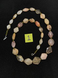 A beautiful string of Bended white agate natural found from Afghanistan dating 1800 yrs. They are found at that time in Afghanistan mostly but also some found in India and Pakistan too. They were used as a special charm jewellery by the affluents at that time period. Beautiful counter bronze are decorated further in between the beads. Necklaces For Jewelry Making With Polished Tumbled Beads, Carnelian Gemstone Beads Necklace For Healing, Vintage Gemstone Beads Jewelry For Healing, Agate Jewelry With Oval Gemstone Beads, Bohemian Jewelry With Polished Beads, Vintage Jewelry With Round Natural Stones, Oval Agate Bead Jewelry With Gemstones, Bohemian Jewelry With Polished Tumbled Beads, Polished Tumbled Bead Necklaces As Gifts