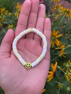 White and yellow clay bead bracelet. Made with clear elastic string that fits most teen writs. Casual Yellow Beaded Friendship Bracelets, Casual Yellow Friendship Bracelets, Casual Yellow Beaded Bracelets With Colorful Beads, Casual Hypoallergenic Yellow Jewelry, Casual Yellow Hypoallergenic Jewelry, Casual Round Yellow Jewelry, Yellow Adjustable Beaded Bracelets Playful Style, Casual Yellow Round Jewelry, Adjustable Yellow Playful Beaded Bracelets