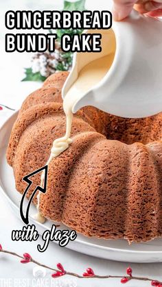 a bundt cake with glaze being drizzled over it on a white plate