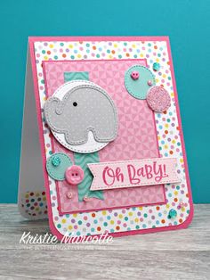 a pink card with an elephant on it and polka dots around the edges that says oh baby