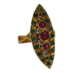 This is part of Chairish’s Fine Jewelry assortment.  SIZE: 6 1/2″ METAL: 18k yellow gold MAIN STONES: 3 center rubies, .30 ct; 2 additional, .16 ct each; total rubies .62 ct, color purplish red STONES: Diamonds, .30 ct, clarity SI1, color G-H STONES: 16 emeralds, .42 ct, color light bluish green WEIGHT: 8 grams CONDITION: Vintage Deco, Excellent  The Art Deco pagoda Emerald and Ruby ring was all the rage during the early 1930's. The 1930's brought back a fascination with all things Asian. The 19 Antique Yellow Gold Multi-stone Ruby Ring, Antique Multi-stone Ruby Ring In Yellow Gold, Red Stones, Ruby Emerald, Bluish Green, Red Stone, Ruby Ring, Emerald Diamond, Early 20th Century