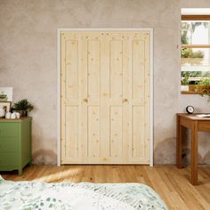 a bedroom with a bed, desk and two doors