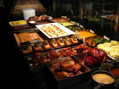 a buffet table filled with lots of food