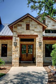 a stone house with a wooden front door