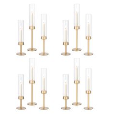 set of six brass and glass candle holders with candles on each side, in the shape of