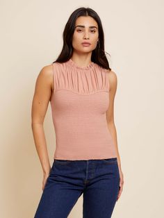 A sleek silhouette with a comfortable feel? The perfect combo. Ruffled mock neck, a shirred yoke and a smoked bodice that hugs in all right places. (This one comes in Bisou.) | Women's Cynthia Tank Top in Bisou | Ethical Essentials Nation Ltd, Layered Tank, Layering Tanks, Ruffle Top, Mock Neck, Smocking, Bodice, Tank Top, Sleek