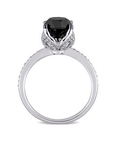 This beautiful black and white diamond engagement ring is crafted in lustrous 14-karat white gold and showcases a striking round-cut black diamond at the center with 12 pave-set twinkling diamond along the sides. This ring is enhanced with a high polish finish. Elegant Evening Rings With Center Stone, Macy's Round Cut Ring As Gift, Macy's Round Cut Rings As Gift, Macy's Fine Jewelry Promise Ring, Classic White Gold Rings From Macy's, Macy's Promise Ring With Diamond Cut, Macy's 14k White Gold Rings For Formal Occasions, Macy's 14k White Gold Formal Rings, Elegant Evening Diamond Ring With Center Stone