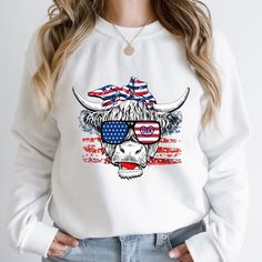 4th of July Sweatshirt, July 4th Sweater, 4th of July Shirt, Crewneck Sweater, Patriotic Shirt, USA, American Cow Shirt, American Flag A sturdy and warm crewneck sweatshirt bound to keep you warm in the colder months. A pre-shrunk, classic fit sweater that is super comfortable. This sweatshirt will make a great gift for Independence Day. * 50% cotton, 50% polyester  * Pre-shrunk * Classic fit Relaxed Fit Graphic Print Sweatshirt For 4th Of July, Patriotic Letter Print Sweatshirt For Independence Day, White Crew Neck Sweatshirt For 4th Of July, White Long Sleeve Tops For Independence Day, Patriotic White Cotton Sweatshirt, 4th Of July Graphic Print Crew Neck Sweatshirt, Long Sleeve Tops For 4th Of July, White Long Sleeve T-shirt For Independence Day, 4th Of July American Flag Print Crew Neck Sweatshirt