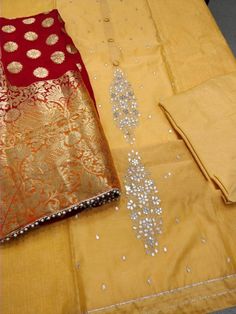 Item Overview ATHARVA Hand Embroidered Salwar Kameez w/Beautiful Embroidered Panel & Side Thread work in Yellow Chanderi w/Beautiful Banarsi Silk Dupatta Dno. CH1089 Fabric: * Shirt Chanderi Silk - Yellow - 2.5 Mtrs * Dupatta: Pure Banarsi Silk - 2.5 Mtrs * Bottom Santoon Silk - Yellow - 2.5 Mtrs Excusive Hand Embroidered Party Wear Punjabi Suit. Customization: * Fabrics: Designs Can be made in different Fabrics. * Stitching Available Care: * Dry Clean/ Avoid direct Ironing on Embroidery Part. * Traditional Festive Dola Silk Sets, Festive Traditional Dola Silk Sets, Traditional Unstitched Suit With Zari Work For Celebration, Traditional Gold Unstitched Suit With Zari Work, Chanderi Unstitched Suit With Dabka Work For Celebration, Festive Unstitched Jamawar Suit With Dabka Work, Traditional Gold Dola Silk Unstitched Suit, Festive Unstitched Suit With Dabka Work In Jamawar, Traditional Gold Unstitched Dola Silk Suit