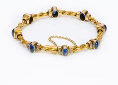 Antique Gold Sapphire Diamond Bracelet Vintage Gold Sapphire Jewelry, Heirloom Single Cut Diamond Bracelet, Gold Cabochon Bracelet In Fine Jewelry Style, Yellow Gold Cabochon Bracelets For Weddings, Heirloom Yellow Gold Gemstone Bracelets, Gold Sapphire Bracelets, Oval Yellow Gold Bracelet With Single Cut Diamonds, Formal Yellow Gold Diamond Bracelet With Rose Cut Diamonds, Gold Sapphire Bracelets For Anniversary