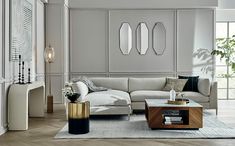 a living room filled with furniture and decor on top of a hard wood floored floor