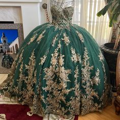 Emerald Green & Gold Embroidered Quinceaera Dress W/Tule Cape. Dress Has Multiple Layers Of Perfection, And Beautiful Jewels. Skirt And Cape Have A Slight Train. Excellent Condition, No Imperfections. Two Dresses Available: Both Are Size 6, One Taken In To Fit A Size 4. Corset With Pull String Will Allow For Comfortable Adjusting. Quinceanera Dresses With Intricate Embroidery, Green Lace Dress With Intricate Embroidery, Fitted Dresses With Intricate Embroidery For Quinceanera, Green Embroidered Lace Dress, Emerald Quinceanera Dress, Green Quince Dress, Quinceanera Dresses Green, Ball Gown Quinceanera Dresses, Green Quinceanera Dresses