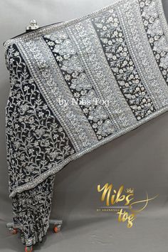 Nibs Tog Lucknowi Chikankari Saree Hand Embroidered with Gotta Patti work Saree is always a perfect dress for any occasion, a small function, or the grand wedding function. This is one of the handpicked from the collection of Nibs Tog, hand-embroidered lucknowi Chikankari Saree with Blouse, stitching available optionally. The Saree has well finished with add ons of Gotta Patti and all over Jaal work embroidered Chikankari. Includes: Saree will be available with Fall & Picco, Petticoat & Stiched bloused available(Optional) Features: Fabric: The handmade Chikankari Saree is made of fine Faux Georgette fabric, soft & comfortable fabric. Blouse piece is available of the same fabric & colour.  Style: The Lucknowi Saree is finely hand dense embroidered on full palla and Jaal Butti works on the r Lucknowi Saree, Black Georgette Saree, Lucknowi Chikankari Saree, Gotta Patti Work, Chikankari Saree, Georgette Saree With Blouse, Saree Georgette, Blouse Stitching, Grand Wedding