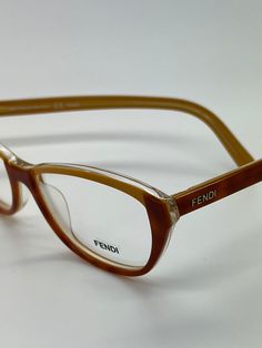 Vintage New Old Stock Fendi Amber Gold Eyeglass Frames Mod F1002 52 15 135. Demo lenses are still intact and are ready for your prescription. Check out my other listings for more great deals on vintage designer eyewear. Fendi Glasses, Vintage Fendi, Glasses Vintage, Designer Eyewear, Eye Wear Glasses, Eyewear Design, Vintage Designer, Glasses Case, Green Crystals