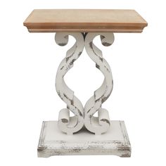 a white and wood table with an intricate design on the top, against a white background