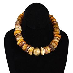 Fall in love with fall! Amber tones lead the way into the change of seasons. Chunks of amber, brass and carnelian with a hammered aluminum center bead. Hangs 17”. Studio Workspace, Workspace Ideas, Change Of Seasons, African Accessories, Jewelry Beads, Lead The Way, The Change, Changing Seasons, Artist Studio