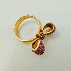 Mimi So 18K Rose Gold Bow Ring with Pink Sapphires (est. retail: $6,800) Designer = Mimi So Size = 6.5 Material = 18K Gold Gemstone = Sapphire Condition = Very Good Class = Premier Location: Glencoe Item Number: 4003-55 Item ID: 271825 Category: Ring Luxury Rose Gold Evening Rings, Elegant Ruby Ring With Diamond For Party, Luxury Ruby Ring For Party, Designer Yellow Gold Rings For Evening, Luxury Pink Gold Ruby Ring, Luxury Pink Ruby Ring For Formal Occasions, Elegant Party Ruby Ring, Luxury Rose Gold Ruby Ring, Luxury Diamond Ruby Ring As Gift