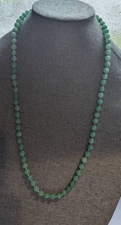 "Chinese Jade Bead Necklace * HALLMARKS Unmarked. * MEASUREMENTS 8mm beads with overall length of 28\". * WEIGHT 61.92 Grams *  MATERIALS Jade, silk cording. * CONDITION In very good to excellent condition, please use pictures as part of description. Art Deco Chinese Jade bead necklace. Beads are strung on hand knotted silk cord and this is the type of necklace with no clasp and it slips over the head. Necklace will arrive gift boxed. Thank you for stopping by!!" Luxury Jade Beaded Necklaces With Natural Stones, Luxury Jade Beaded Necklace With Gemstone Beads, Green Vintage Hand-strung Beaded Necklaces, Hand-strung Green Vintage Beaded Necklaces, Vintage Hand-strung Green Beaded Necklaces, Traditional Beaded Emerald Necklace With Round Beads, Classic Jade Necklaces With Round Beads, Classic Green Beaded Necklaces With Round Beads, Classic Jade Necklace With Round Beads