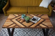 a coffee table with a laptop on it