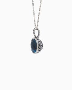 The Square Stone Pendant features a faceted London blue topaz stone set in sterling silver with a unique petroglyph texture. Take notice of the twisted detailing on the bail which adds a playful touch. Pair with your favorite chain, sold separately. Metal: Sterling silver Stone: London blue topaz Dimensions: 23mm x 14mm Stone Size: 12mm x 12mm Style #: P246LB White Gold Topaz Birthstone Jewelry, Polished Sterling Silver Gemstones, Silver Sapphire Oval Pendant Jewelry, Sterling Silver Polished Gemstones For Fine Jewelry, Topaz Birthstone Jewelry With Round Stone, Sterling Silver Birthstone Oval Pendant Jewelry, Oval Topaz Birthstone Jewelry, Elegant Topaz Jewelry With Polished Finish, Polished Topaz Fine Jewelry