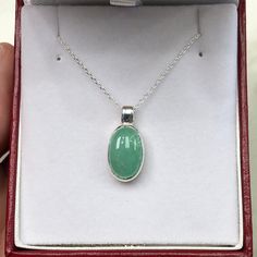 Featured here is a stunning, cabochon oval Colombian emerald necklace in fine .925 sterling silver. Displayed is a light-green emerald bezel set in an elongated silver setting. The earth mined, green Colombian emerald has a light green color with good clarity. An 18 inch chain is included with the emerald pendant. This is an excellent gift for a May baby or for someone who simply loves emeralds. Total Carat Weight: 5.0cts Setting Style: Bezel Setting Material: .925 Sterling Silver Main Stone: Co Elegant Cabochon Necklace For May Birthstone, Classic Jade Jewelry For May Birthstone, White Gold Oval Cabochon Necklace For Anniversary, Formal Jade Jewelry With Natural Stones, Fine Jade Jewelry For Formal Occasions, Sterling Silver Jewelry With Oval Cabochon, Sterling Silver Emerald Pendant Necklace For Formal Events, Elegant Oval Cabochon Jewelry With Natural Stones, Fine Jewelry Oval Necklace With Polished Finish